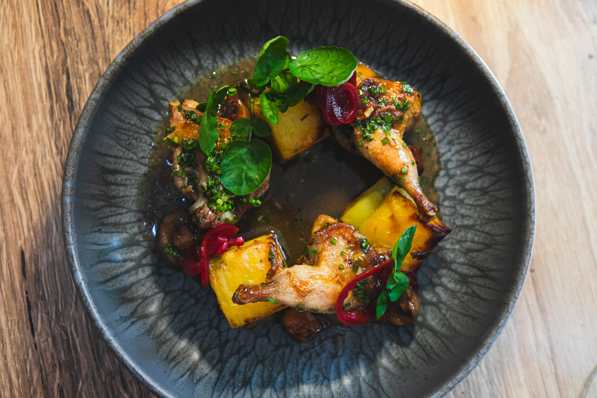 A dish from TERRA's fall menu served on a dark plate